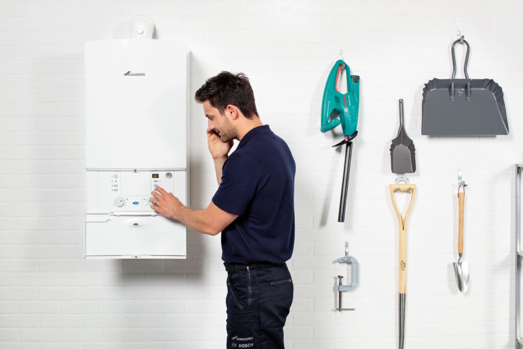 Worcester Bosch Greenstar CDi Classic Installer On Phone Garage min
