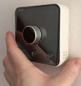 Smart heating thermostat on a wall